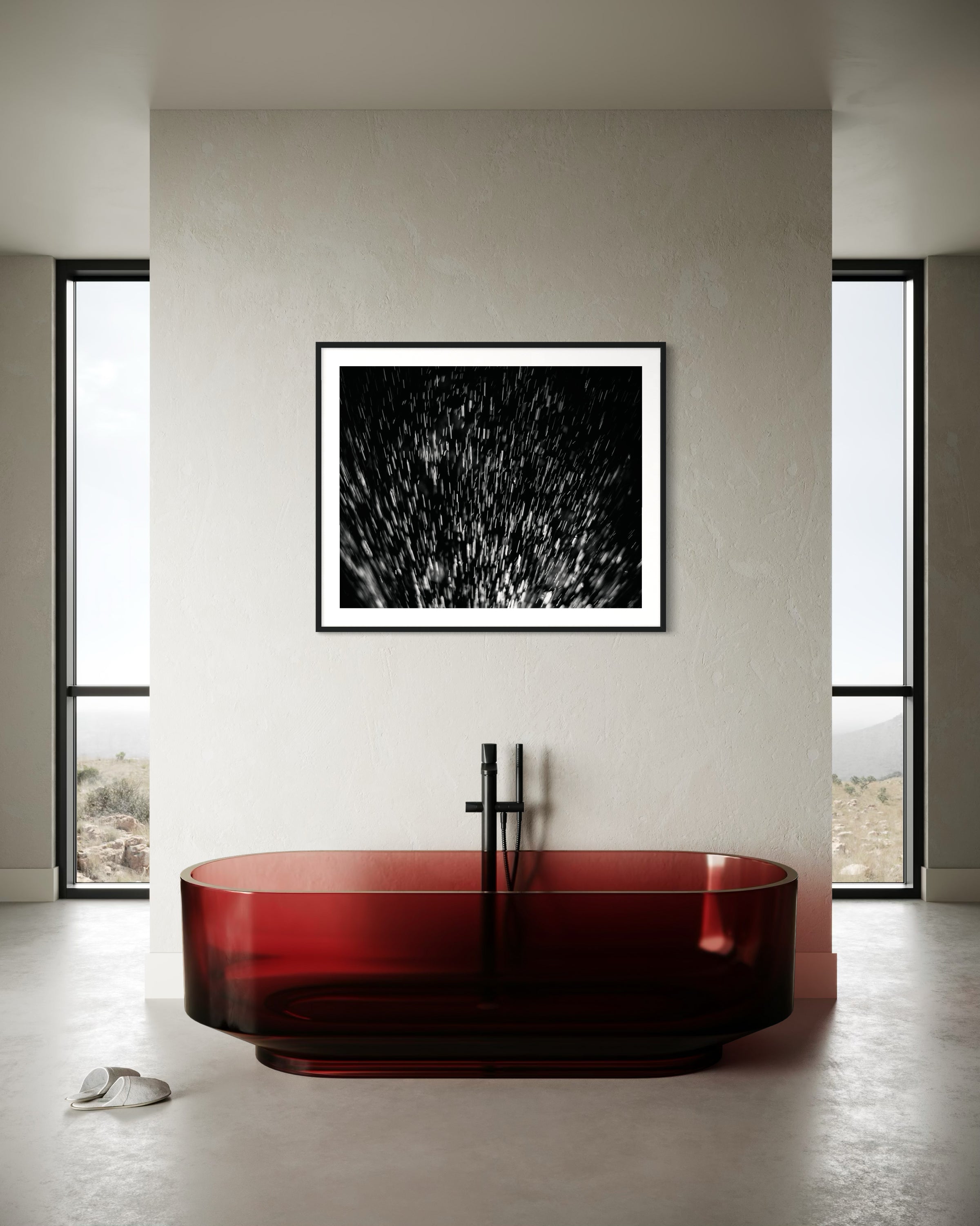 abstract water spray, backlit, spraying up, macro, black and white, photo art print in black frame on light tan wall in very minimalist bathroom with red glass bathtub and concrete floors