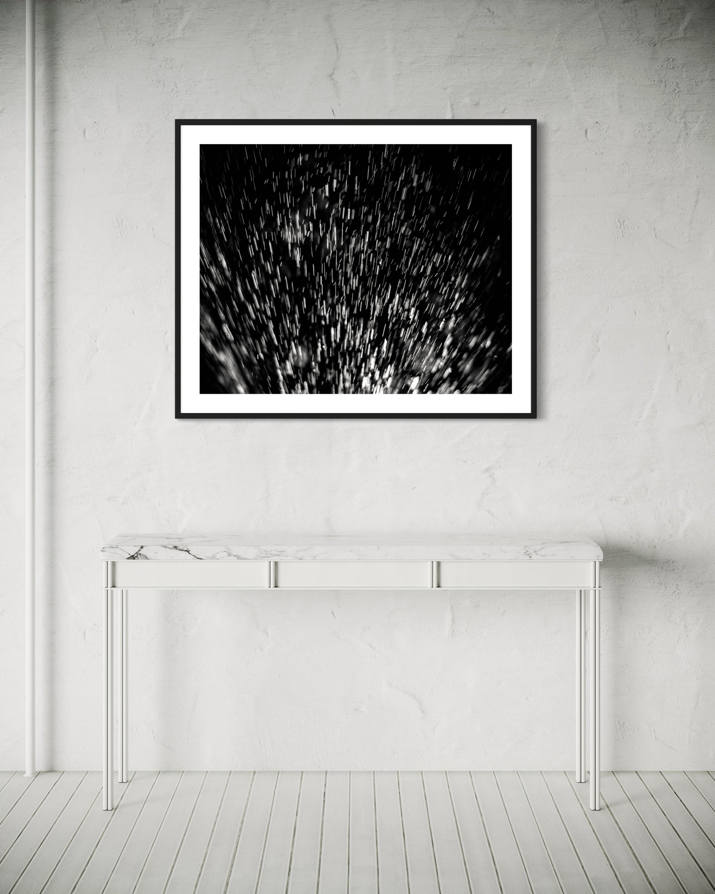 abstract water spray, backlit, spraying up, macro, black and white, photo art print in black frame on wall in very minimalist  monochrome, off white, modern room