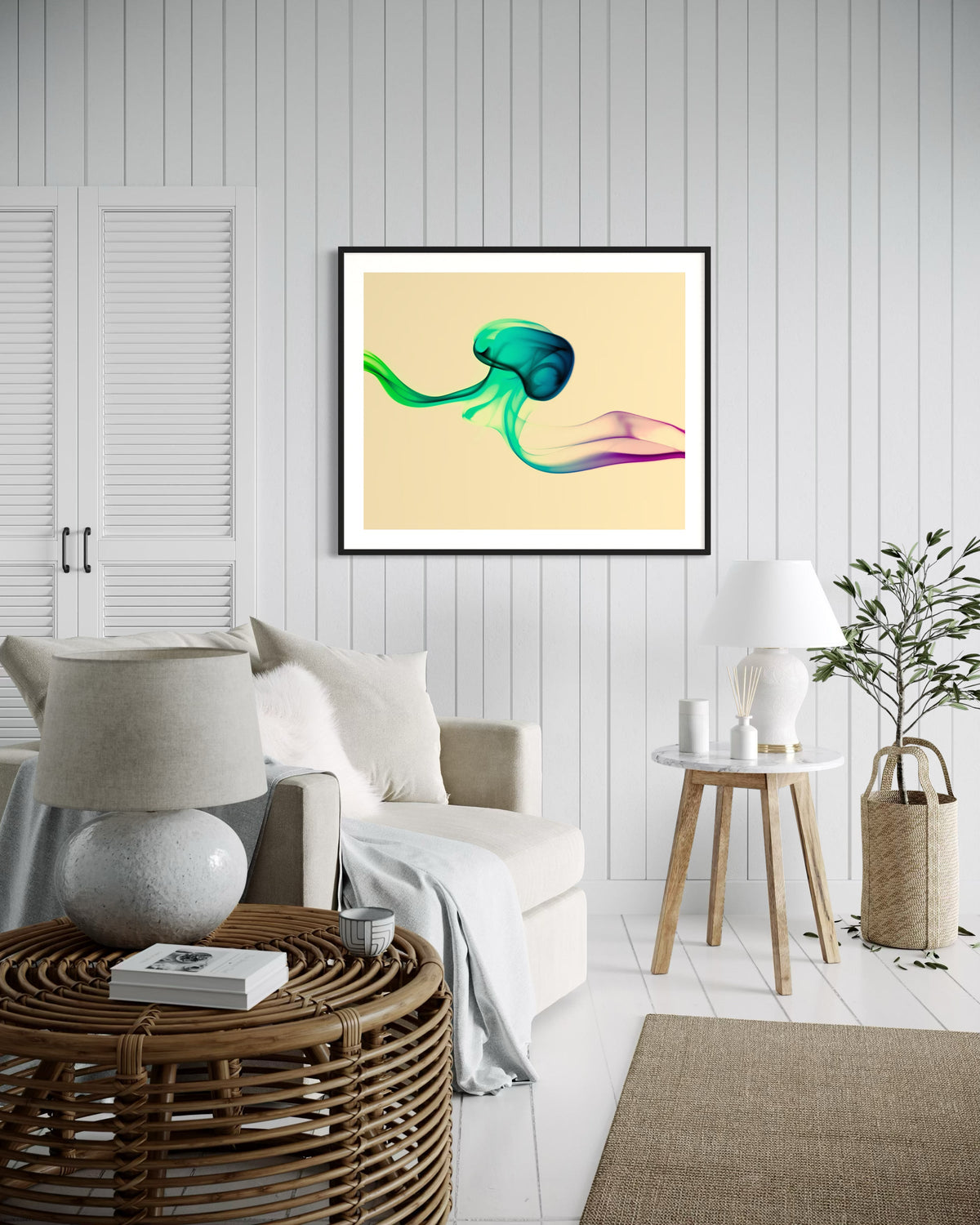 photo of abstract purple, green, blue, yellow wave at the bottom on orange overall in black frame with white matte on white wall beach style sitting room with white tones and tan accents