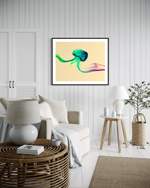 photo of abstract purple, green, blue, yellow wave at the bottom on orange overall in black frame with white matte on white wall beach style sitting room with white tones and tan accents