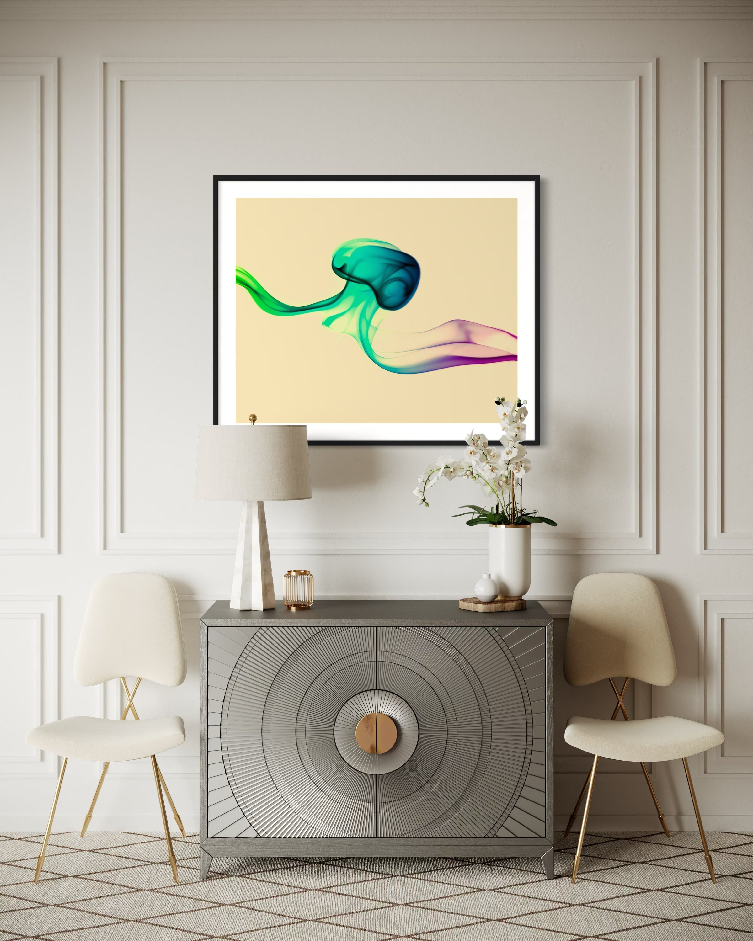 photo of abstract purple, green, blue, yellow wave at the bottom on orange overall in black frame with white matte on white wall above small warm gray piece of furniture in upscale home
