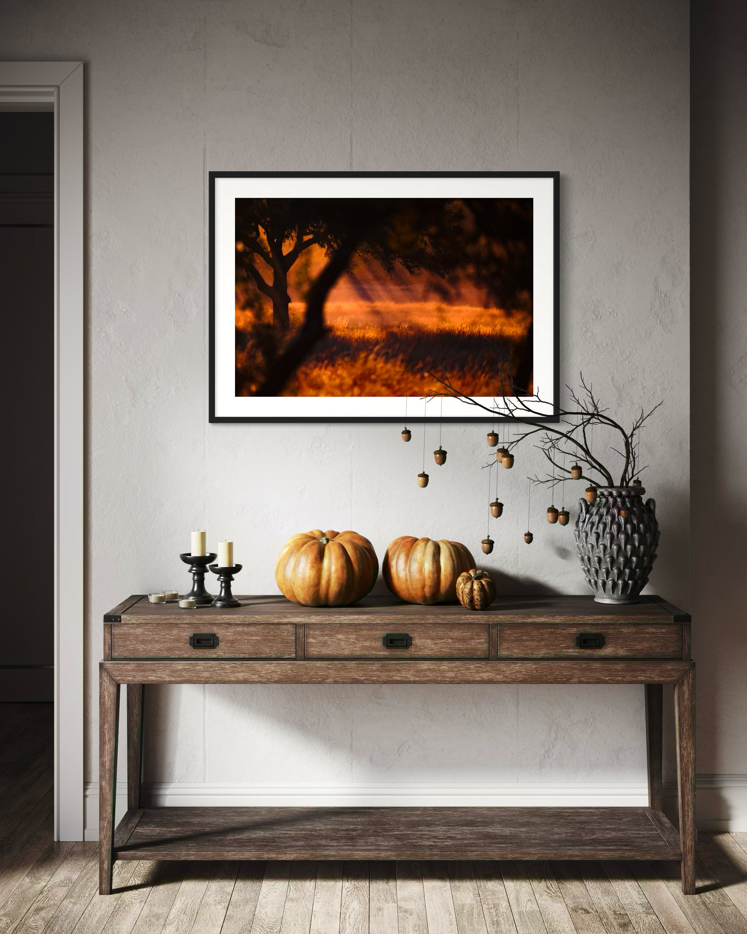 photo of rays of sunlight through the trees in black frame with off white matte on light gray wall above long table in rustic home