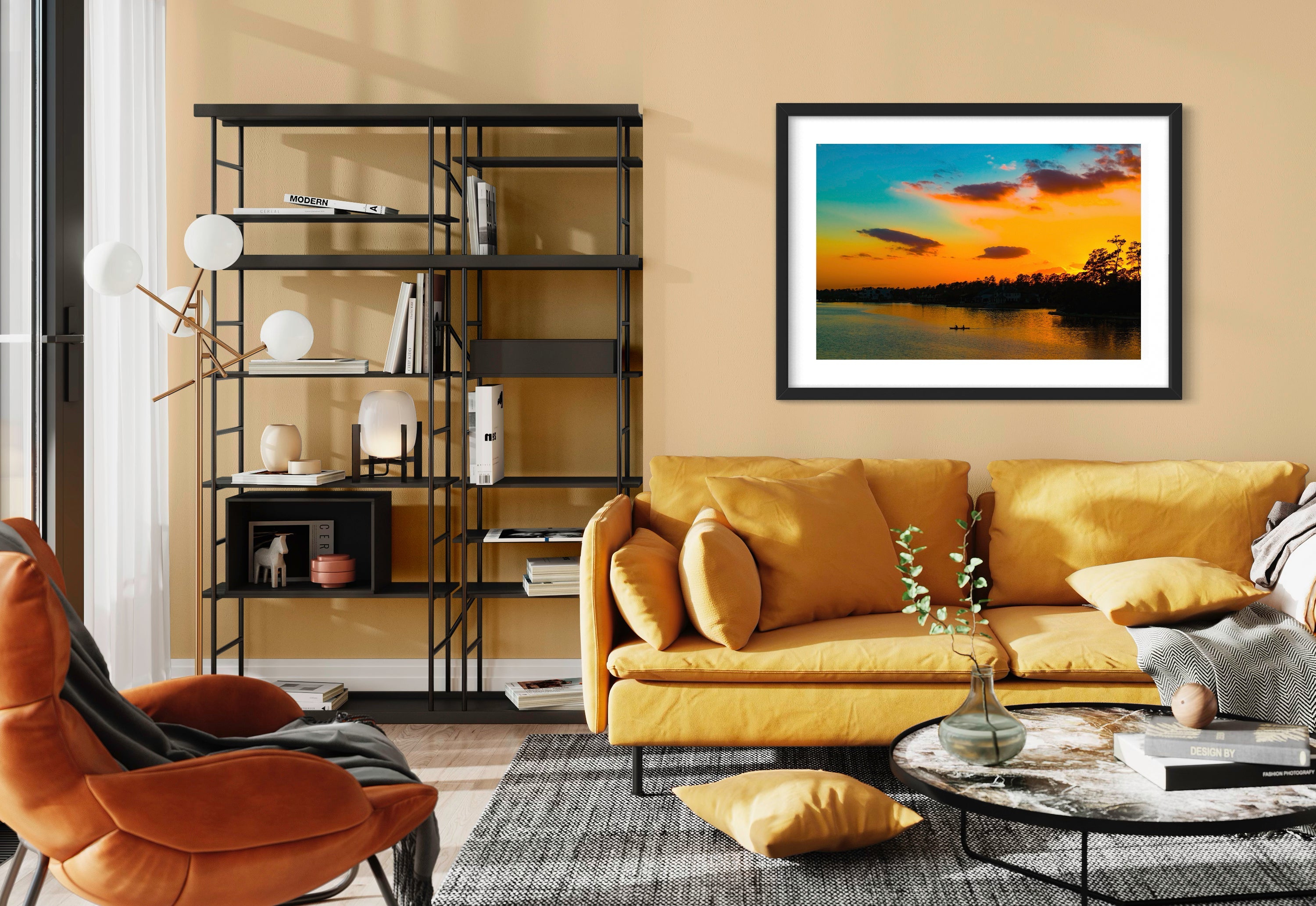 wide angle photo of kayak on lake at sunset in black frame on wall in modern, colorful living room
