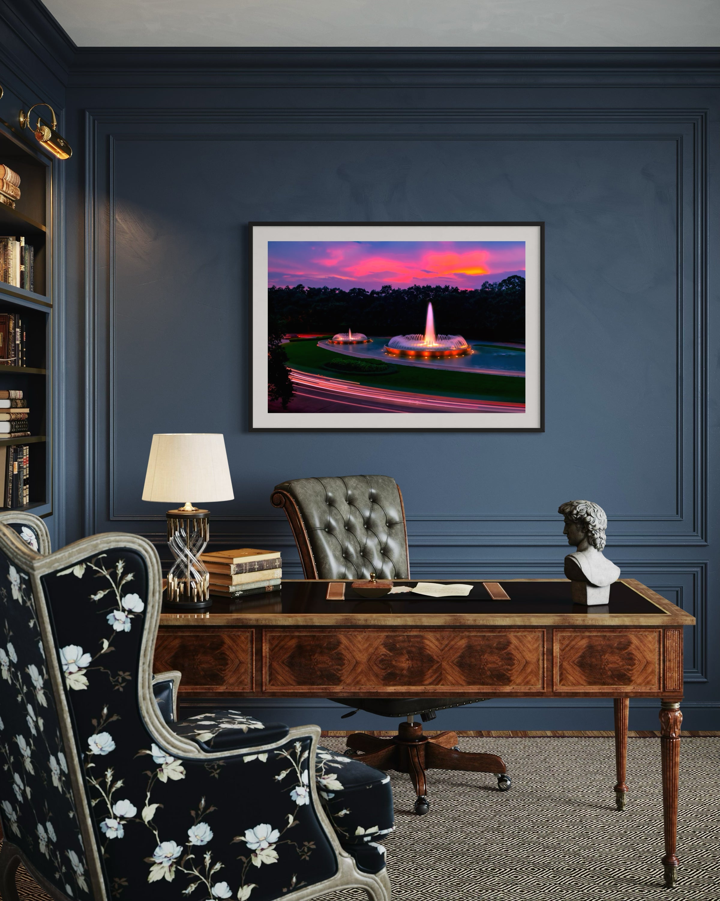 photo of Mecom Fountain in Houston shot at sunset with blurred car lights at the bottom in black frame with off white matte on blue wall in upscale home office 
