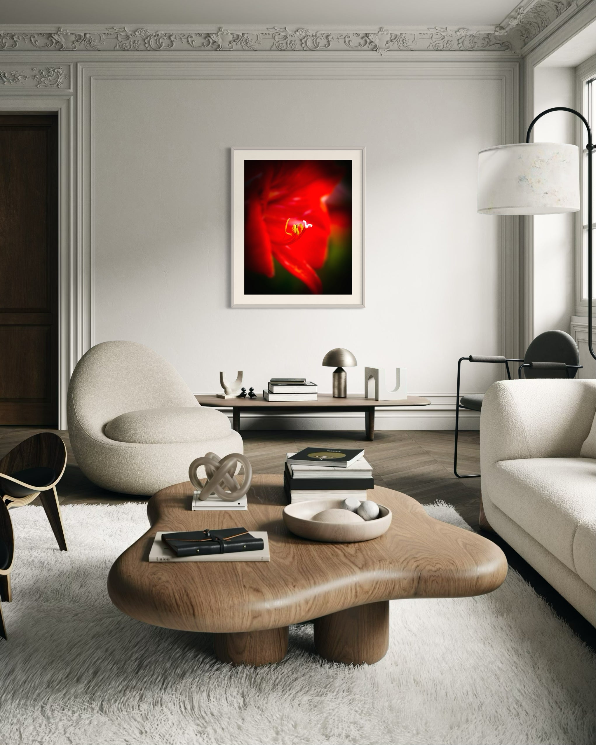 macro photo of red flower, selective focus in light gray frame on light gray wall in eclectic living room with gray and earth tones