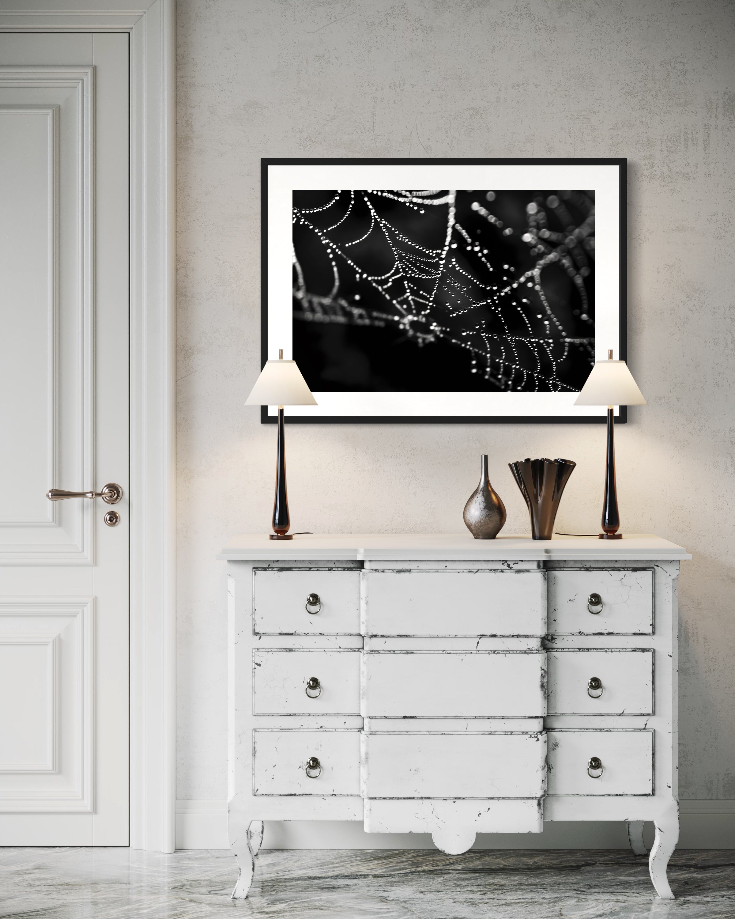 close up photo of rain drops on spider web in black and white in black frame on white wall in modern yet rustic living room