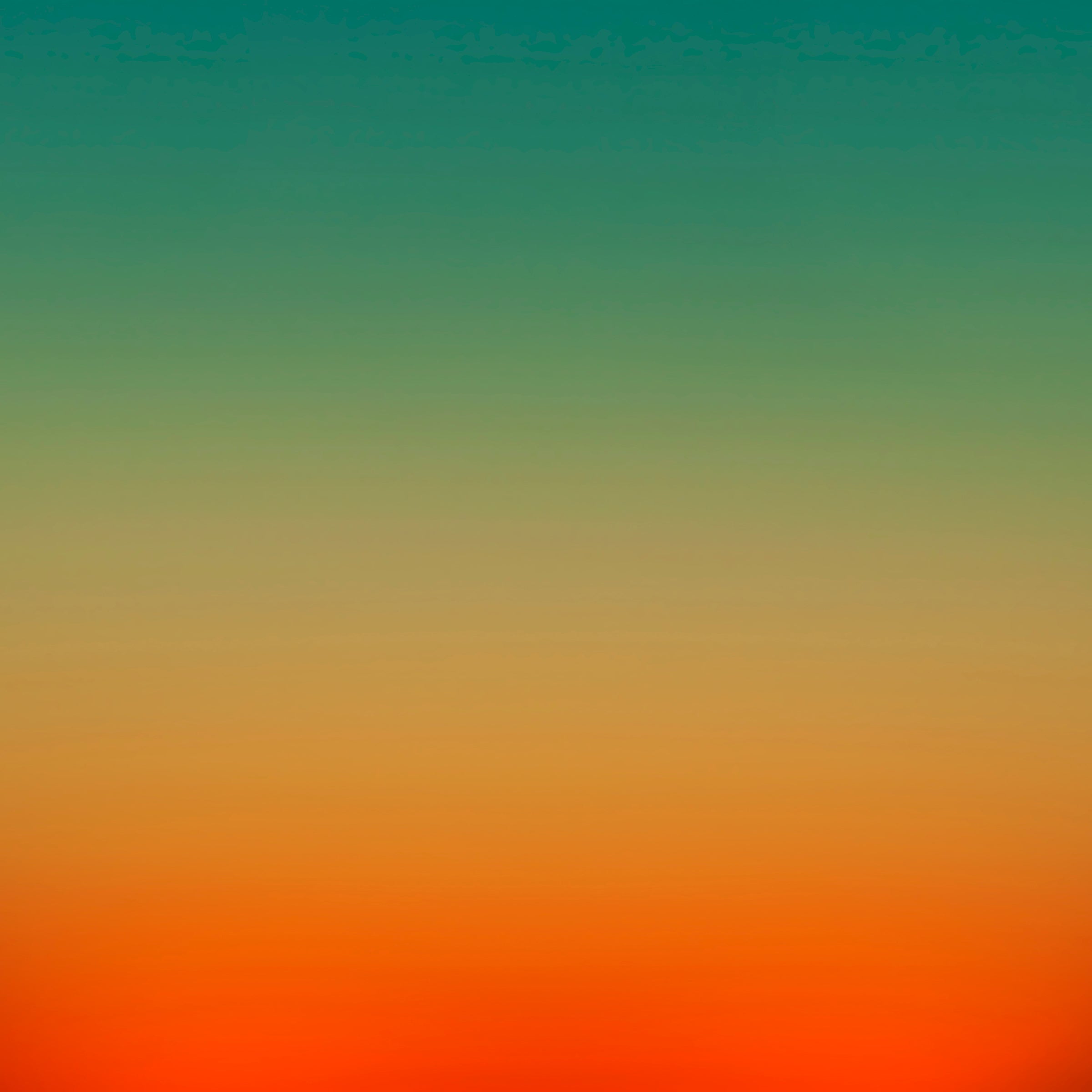 photo, gradient top to bottom teal blue, pale yellow and then orange