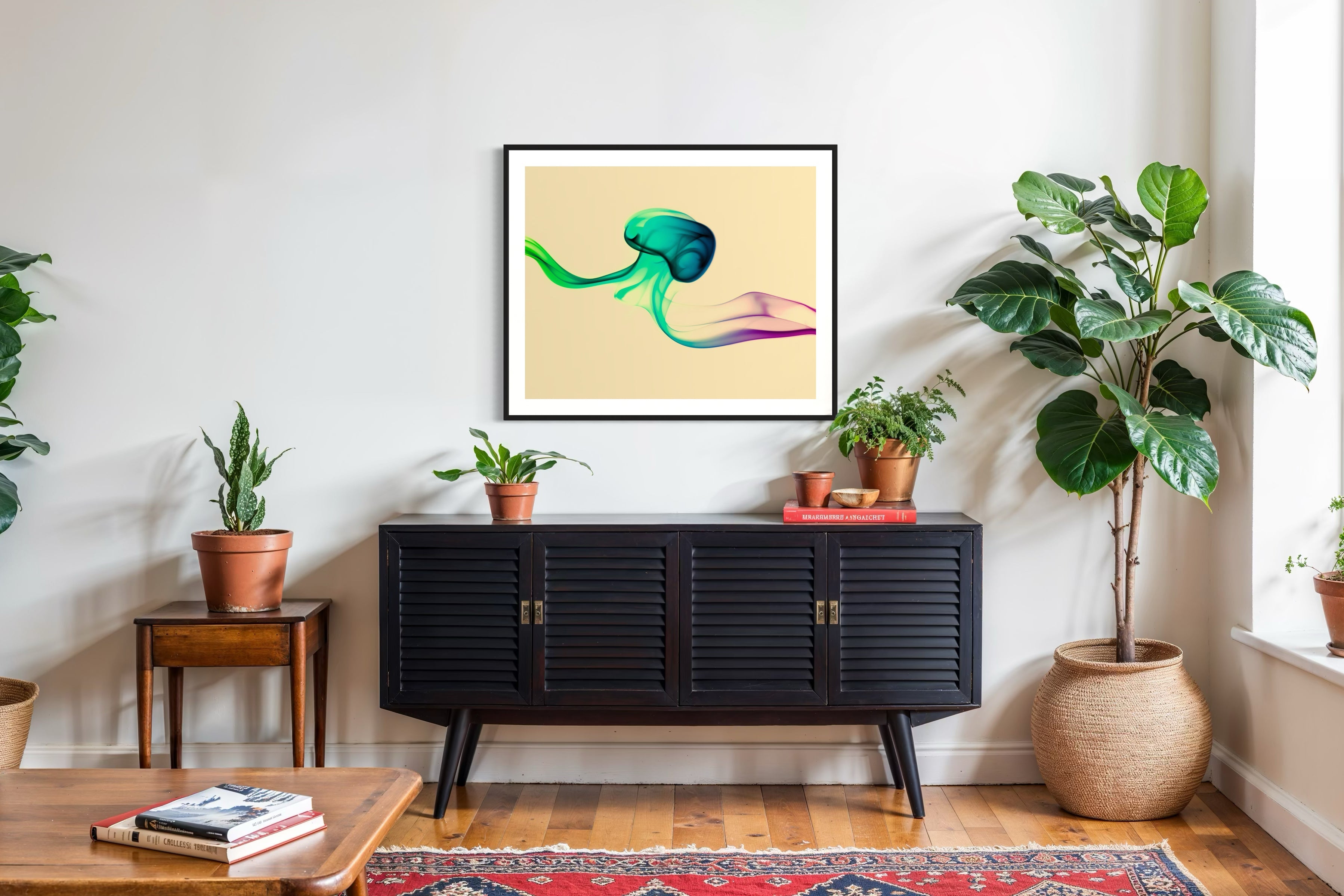 photo of abstract purple, green, blue, yellow wave at the bottom on orange overall in black frame with white matte on white wall above black piece of furniture on hardwood floors