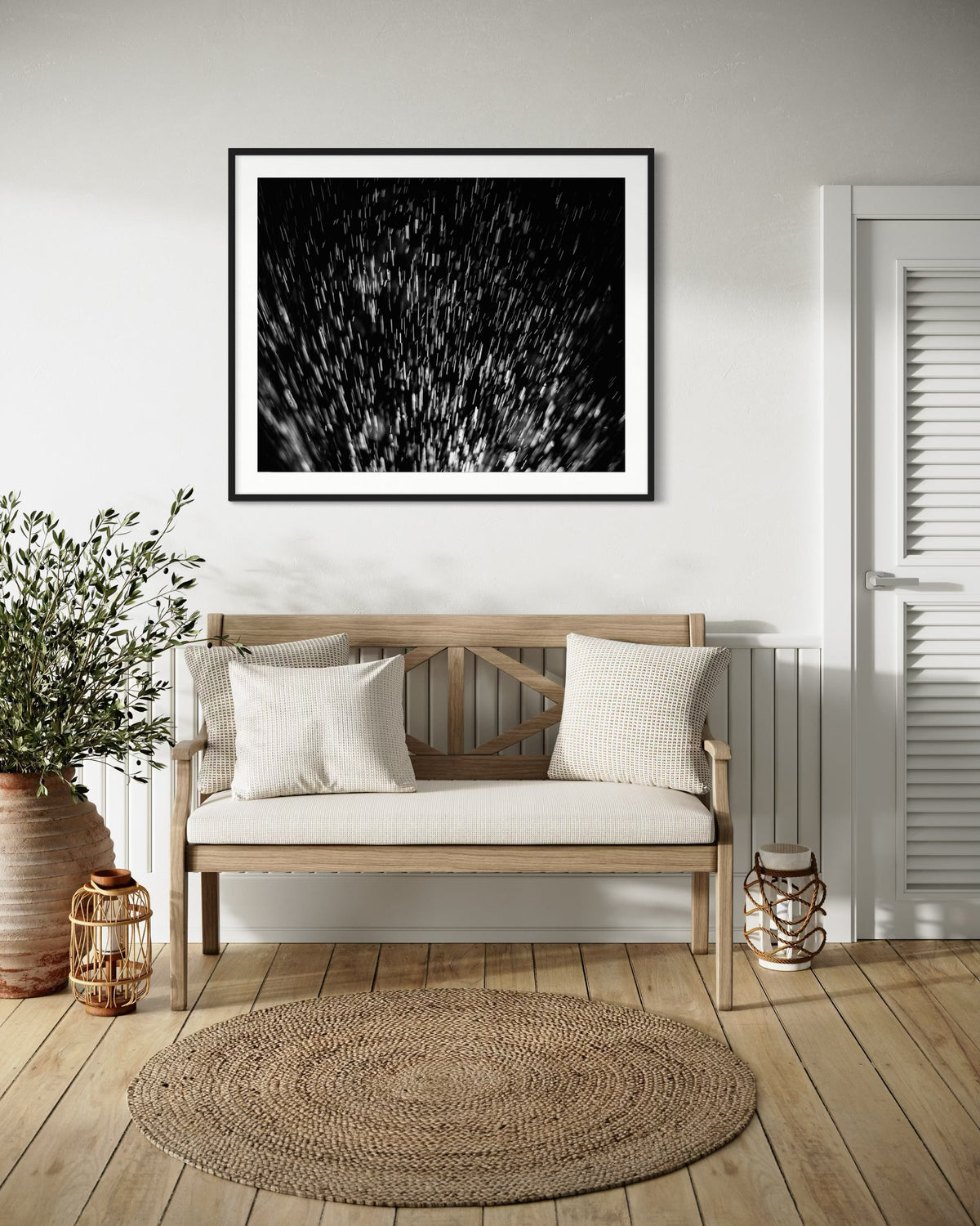 abstract water spray, backlit, spraying up, macro, black and white, photo art print in black frame on white wall in country style sitting area with natural wood bench and hardwood floors