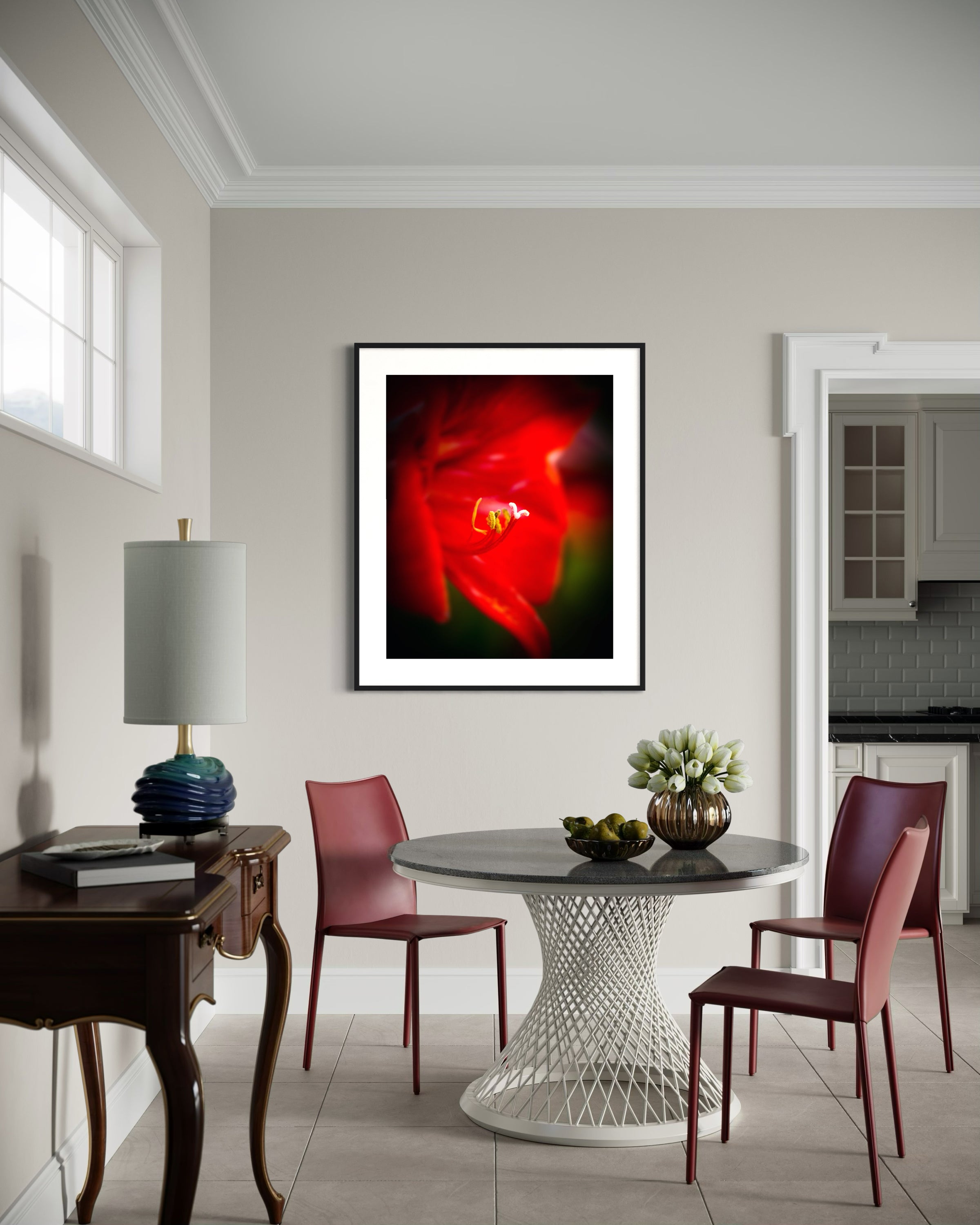Dining room with a modern table and chairs, a lamp, and a framed abstract artwork on the wall.
