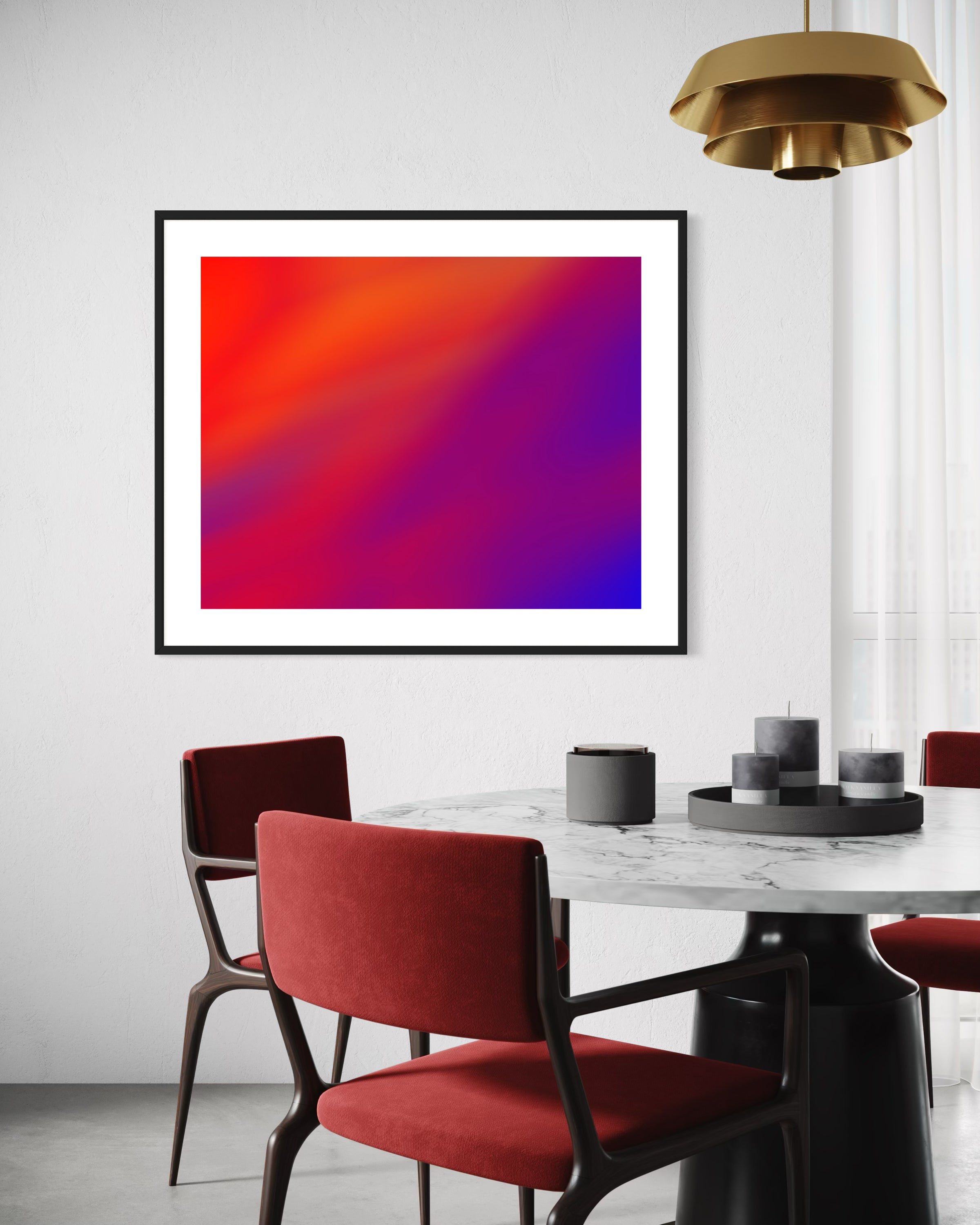 photo of abstract orange, yellow and purple in black frame with white matte on tan wall in modern breakfast area