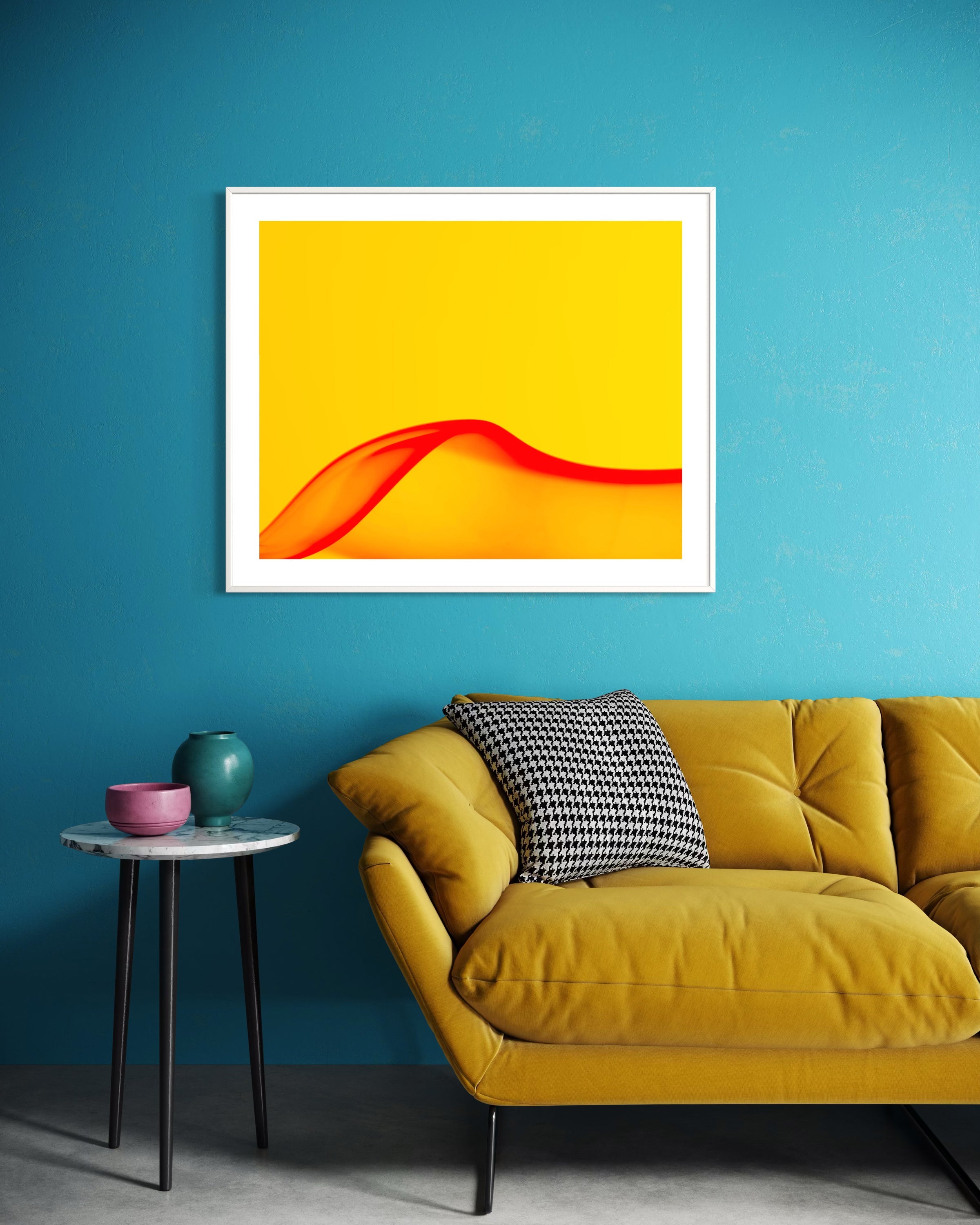 Yellow sofa with a colorful abstract painting on a blue wall