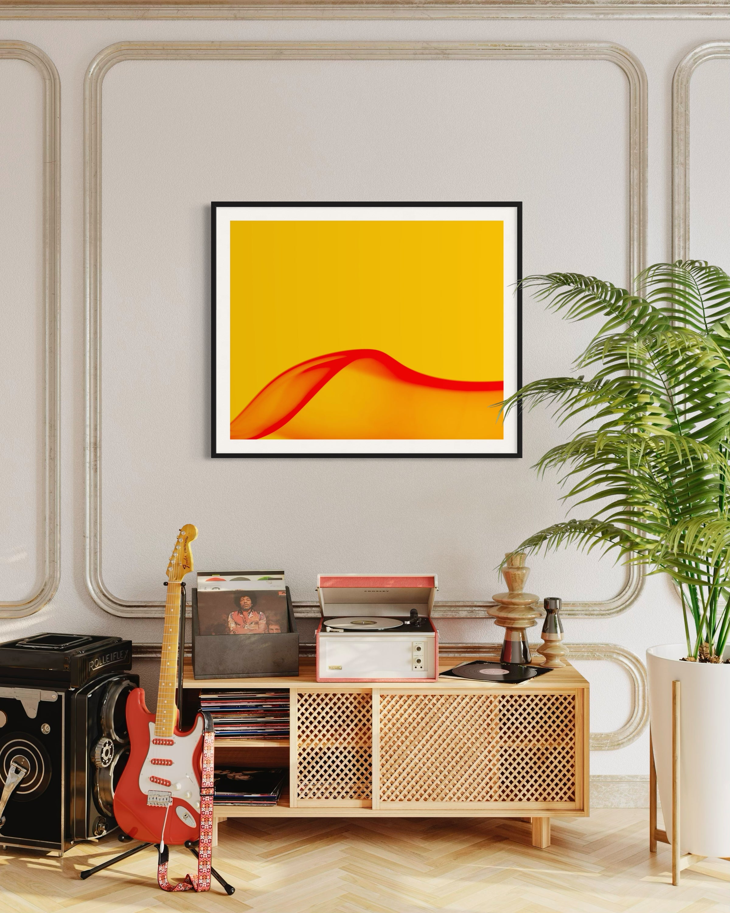 A vibrant room featuring a red electric guitar, vintage records, and a record player on a wooden console. A yellow abstract art piece hangs above, exuding warmth. A lush potted plant adds a touch of greenery.